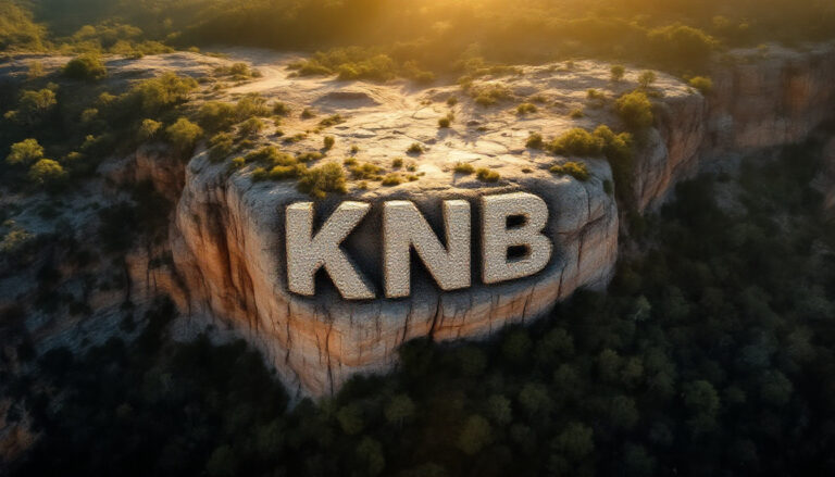 Koonenberry Gold Ltd-KNB-KNB letters carved into cliff at sunset.