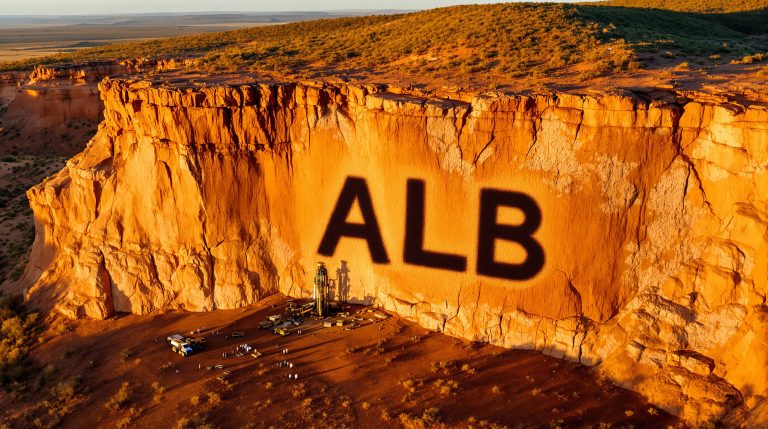Albion Resources Ltd-ALB-ALB shadow on desert cliff face.