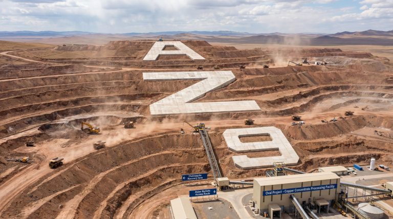 Asianbatterymet Plc Chess Depositary Interests 1:1-AZ9-Copper mine with large industrial signage.