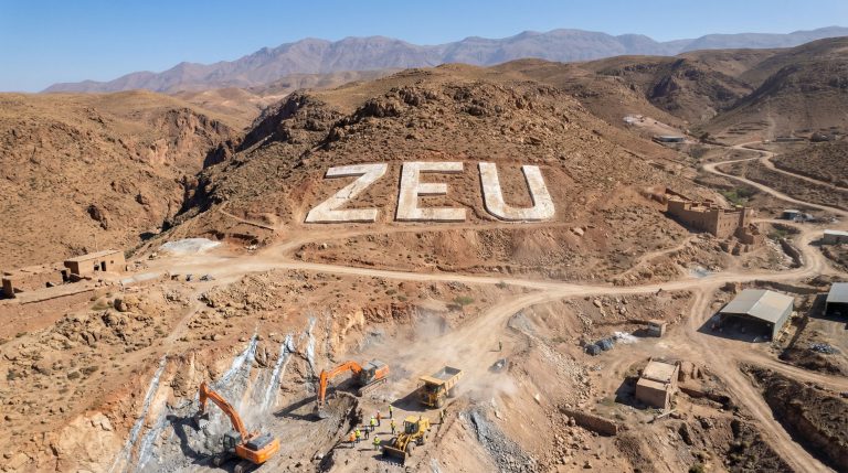 ZEUS Resources Ltd-ZEU-ZEUS site with construction vehicles, desert background.