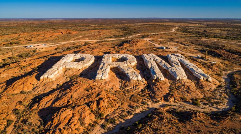 Prominence Energy Ltd-PRM-PRM letters carved into rocky terrain.