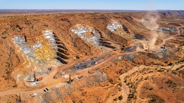 Heavy Rare EARTHS Ltd-HRE-Open-pit mining site in rugged terrain.