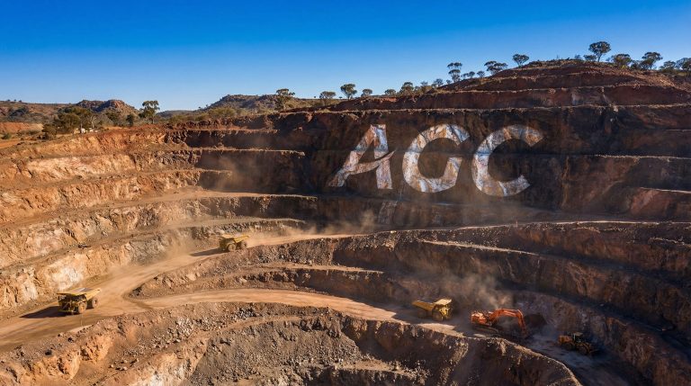 Australian Gold and Copper Ltd-AGC-Open-pit mine with heavy machinery operating.