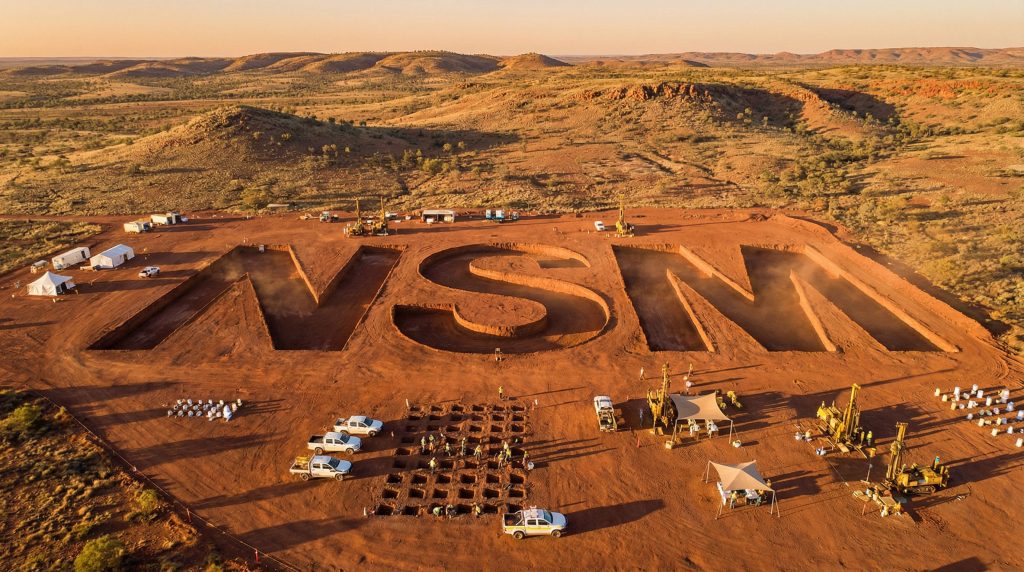 North Stawell Minerals Ltd-NSM-Huge NSM letters excavated in desert.