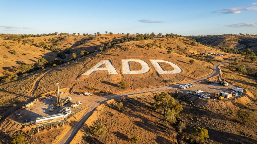 Adavale Resources Ltd-ADD-ADD letters on arid hillside landscape.