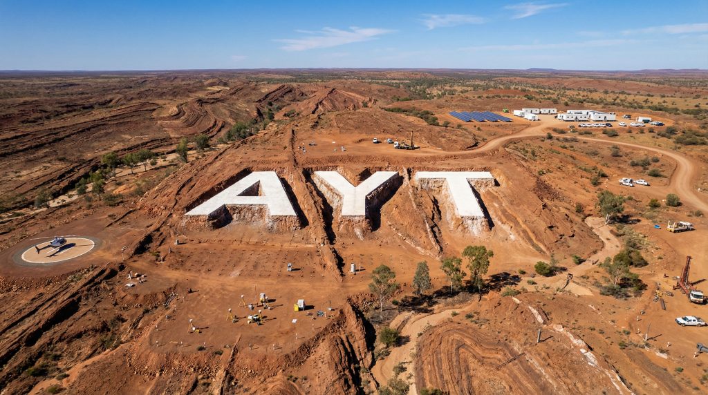 Austin Metals Ltd-AYT-AYT letters on Australian outback landscape.