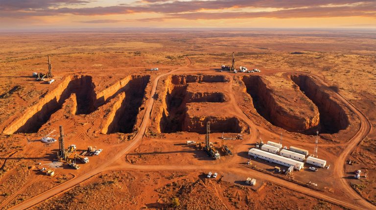 Marmota Ltd-MEU-Mining letters carved into red earth.
