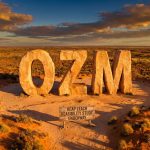 Ozaurum Resources Ltd-OZM-OZM desert monument with study sign