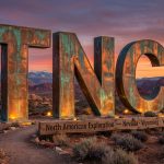 True North Copper Ltd-TNC-TNC monument in desert landscape at sunset