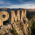 Pioneer Minerals Ltd-PMM-PMA mountain survey with aircraft overhead