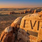 EV Resources Ltd-EVR-EVR carved into desert canyon rock