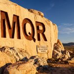 Marquee Resources Ltd-MQR-MQR carved into desert rock formation