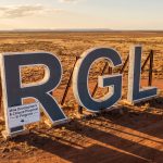 Riversgold Ltd-RGL-RGL sign in remote desert landscape