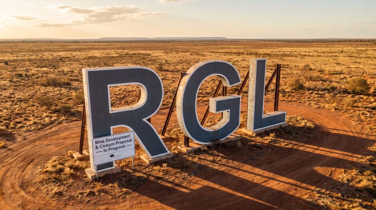 Riversgold Ltd-RGL-RGL sign in remote desert landscape