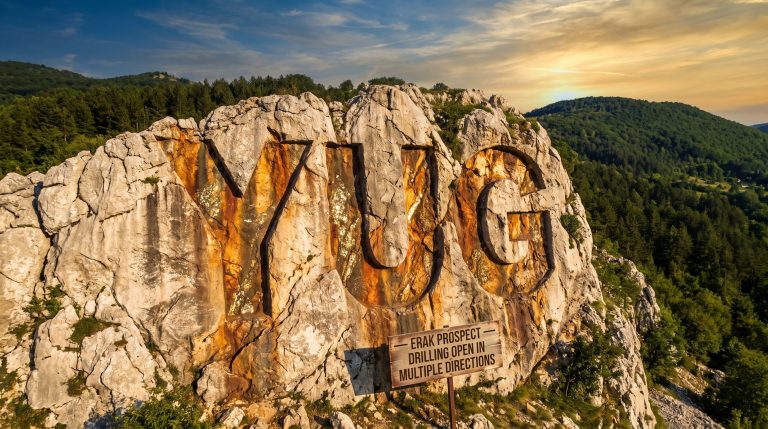 Yugo Metals Ltd-YUG-YUG carved into rocky mountainside at sunset