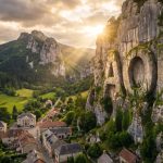 Apollo Minerals Ltd-AON-Couflens France village beneath dramatic cliffs